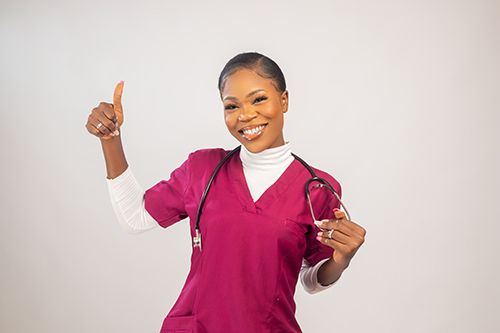 beautiful and obviously incredibly clever female doctor with a stethoscope giving a thumbs up over white background - she has it under control with the accounting software she uses, Joy Pilot