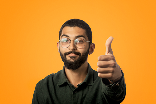 big thumbs up from the gentleman with close cut hair and beard wearing glasses